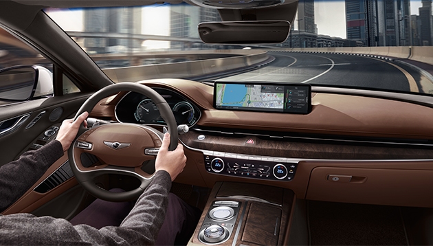 Close up of Genesis dashboard and steering wheel.